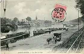 Vue générale de l'Île-Saint-Denis et notamment de l'église Saint-Pierre, vue depuis le port de Saint-Denis.