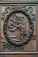 Relief sur bois, basilique Sainte Marie-Madeleine de Saint-Maximin-la-Sainte-Baume. Le Christ offre trois flèches à la bienheureuse, l'un de ses attributs.