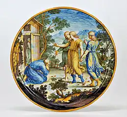 Assiette en majolique peinte avec Abraham et les trois anges, Ferdinando Maria Campani, San Quirico d'Orcia, milieu du XVIIIe siècle.