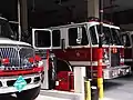 La « Tower ladder 13 » (Auto-échelle pour gratte-ciel n°13) dans sa  caserne, prête au départ.