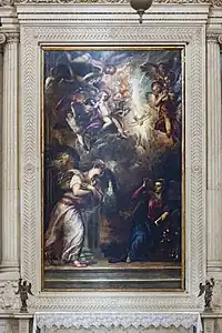 Peinture. L'ange s'adresse à Marie sous un ciel peuplé d'anges à travers lesquels descend la colombe.