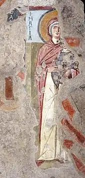 Fresque murale représentant une femme portant un bébé dans les bras