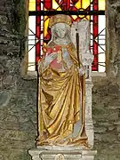 Statue en pierre polychrome du XVIe siècle de sainte Barbe.