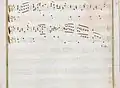 partition manuscrite rehaussée de couleurs passées rouge et vert en bordures et cadre de titre, titre en rouge