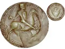 Sceau médiéval montrant un chevalier en armes monté sur son destrier.