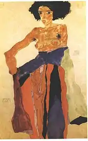 Portrait d'une femme brune en jupe longue et torse nu