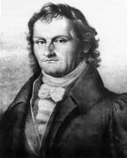 Portrait de Schneider de trois-quart face dessiné au crayon. Il a l'air résolu et a des cheveux longs.