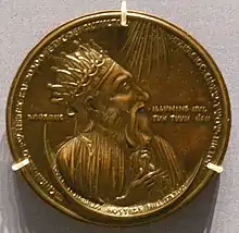 Médaille présentant un homme de profil