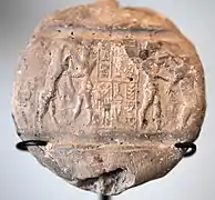 Empreinte du sceau-cylindre de Liburbeli, échanson d'Epirmupi, gouverneur de Suse et d'Élam, sans doute sous le règne de Shar-kali-sharri. Musée du Louvre.