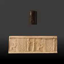 Sceau-cylindre en hématite avec impression de la période de la première dynastie de Babylone, représentant une scène de présentation d'un individu à une divinité, Musée des beaux-arts de Lyon.