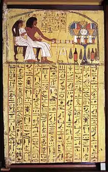Porte de TT1. Panneau de bois montrant Sennedjem et son épouse jouant au senet. Deir el-Médineh. Règne de Ramsès II. Sycomore enduit et peint.