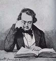 Homme qui ajuste ses lunettes pour lire un livre posé sur une table, il est vêtu d'une veste. Une mention « 24th june 49 » figure écrite en bas à gauche.