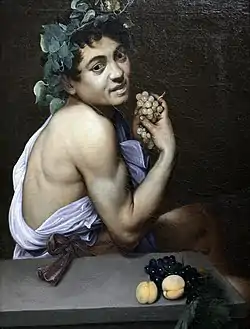 Peinture. Un jeune garçon habillé à l'antique regarde le spectateur, du raisin à la main.