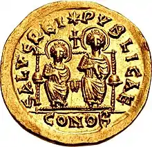 Pièce de monnaie avec deux hommes religieux dessinés en relief.