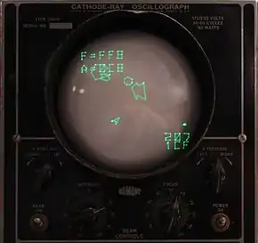 Écran d'oscilloscope affichant un jeu vidéo dont les graphismes sont composés de lignes vertes.