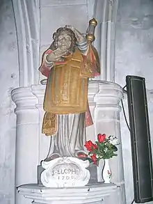 Église de Domrémy, statue de saint Élophe, portant sa tête coupée.