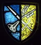 Un vitrail montrant le blason de l'abbaye.