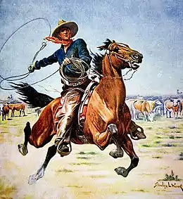 Au milieu d’une prairie, des vaches broutant en arrière plan, un cheval est lancé au grand galop. Son cavalier équipé d’un chapeau en cuir, d’un bandana rouge, d’une chemise bleue et de longue chaps en cuir, fait tourner son lasso.