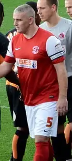 Steve McNulty standing on a grass field