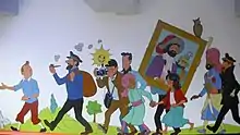Personnages de l'univers de Tintin peints sur un mur blanc.