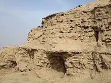 Ziggurat d'Uruk : briques crues et couches de roseaux renforçant l'armature.