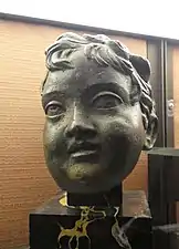 Tête d'Éros en bronze, époque romaine.