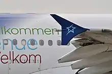 Extrémité de l'aile d'un A310-300, présentant une surface verticale en forme de triangle arrondi.