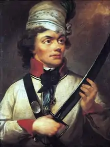 Portrait d'un homme portant une veste blanche et tenant un sabre devant lui.