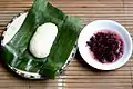 Tapai ketan (right) served with uli (glutinous rice cooked with grated coconut, and mashed;  left).