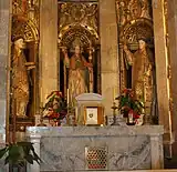 Les saints dans la chapelle des saints martyrs de la cathédrale de Tarragone; statues du XVIIe siècle et reliquaire avec des restes de tous les trois.