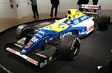 Photo de la Williams FW14B jaune et bleue de Mansell en exposition