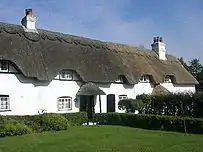 Cottages au toit de chaume à Swan Green.