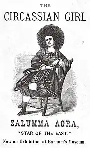 Gravure sur bois, femme aux cheveux crépus assise.