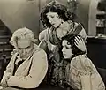 Avec Josef Swickard et Olive Borden (au centre), dans The Eternal Woman (1929, photo promotionnelle)