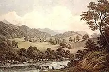 A wooded river valley surrounded by mountains, with a distant grand house and lawns on the far slope