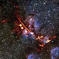 Image de NGC 6334 dans le proche infrarouge réalisée par l'instrument ArTeMiS du télescope VISTA.