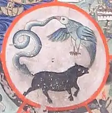 Moyeu de la roue de Thiksey: porc, coq et serpent, symboles respectifs de l'ignorance, la convoitise et la colère.