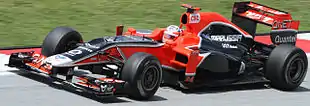 Photographie de Timo Glock dans le cockpit de sa monoplace