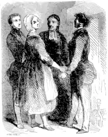 Jeanne et trois hommes discutent près du foyer d'une cheminée.