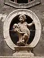 Statue de Simon de Trente sur la façade d'un palace à Trento (situé à "Via del Simonino")