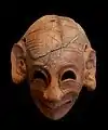 Masque grimaçant, H 0,16 m, terre cuite (fin du VIe siècle av. J.-C.).