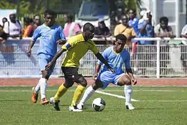 Vue de trois footballeurs