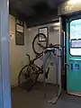 Vélo en hauteur dans train Corail
