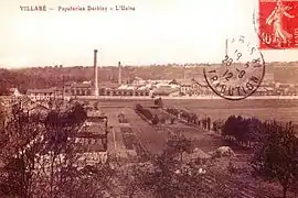 Vue d'une usine et de ses cheminées sur une carte postale des années 1900.