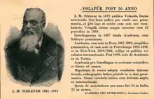 Carte postale en latino sine flexione retraçant brièvement l'histoire du volapük et de l'Academia pro Interlingua, illustrée par un portrait de Johann Martin Schleyer.