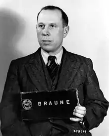Werner Braune (1909-1951), commandant de l'Einsatzkommando 11b, de l'Einsatzgruppe D, a organisé et mené des meurtres de masse de Juifs dans la zone arrière sud du groupe d'armées, le Reichskommissariat Ukraine, au sud de l'Ukraine et en Crimée.
