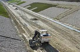 Travaux de terrassement d'un fossé à Poullignac. en 2014.