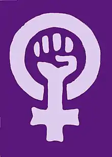 Symbole féministe associant le poing levé au symbole ♀.