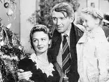 La vie est belle (1946) : Donna Reed, James Stewart et Karolyn Grimes (de g. à d.)