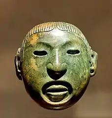 Masque de jade aztèque représentant le dieu Xipe Totec.